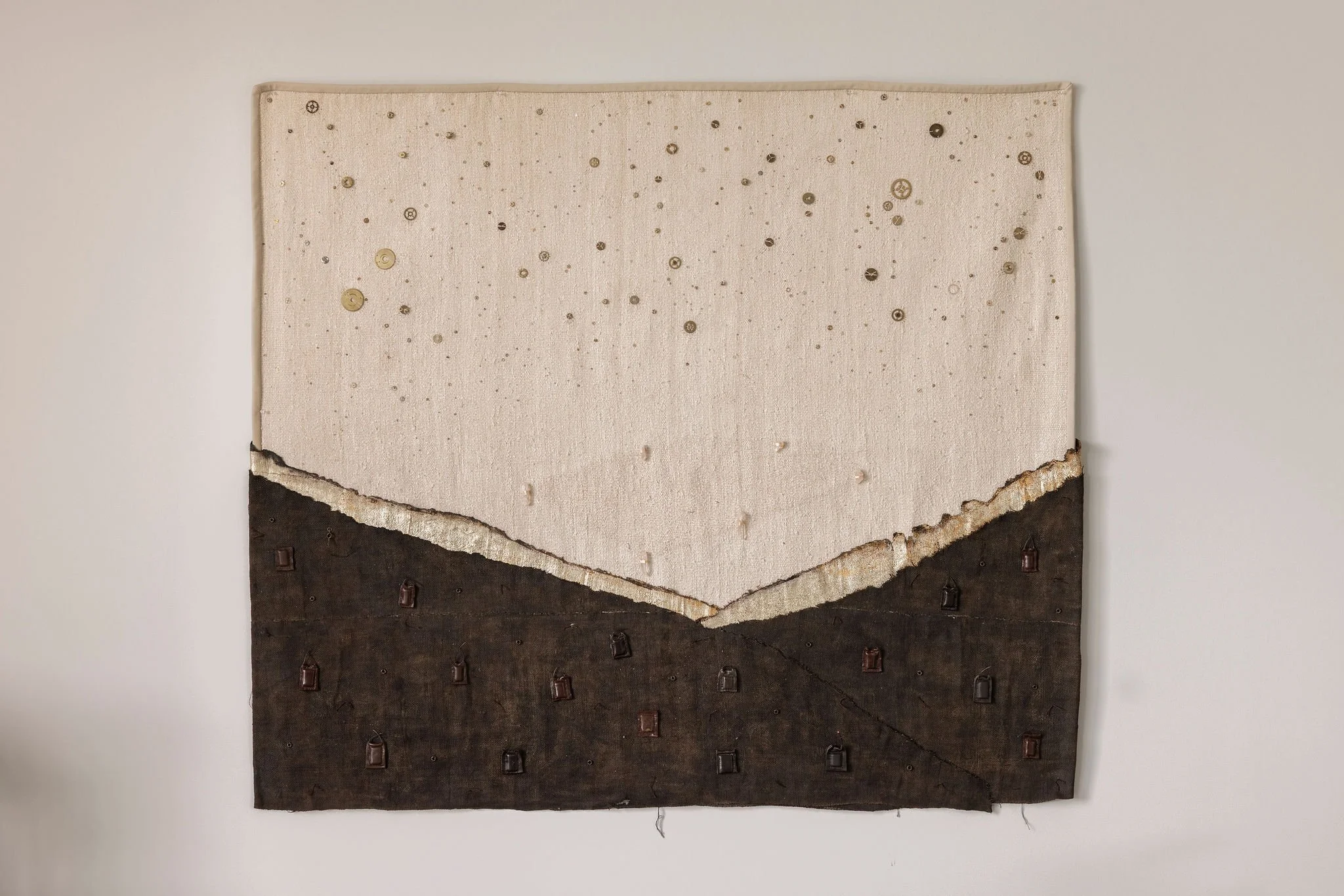 Landscape of Blessings for Peace — a charred and gold-leafed linen/hemp tapestry.