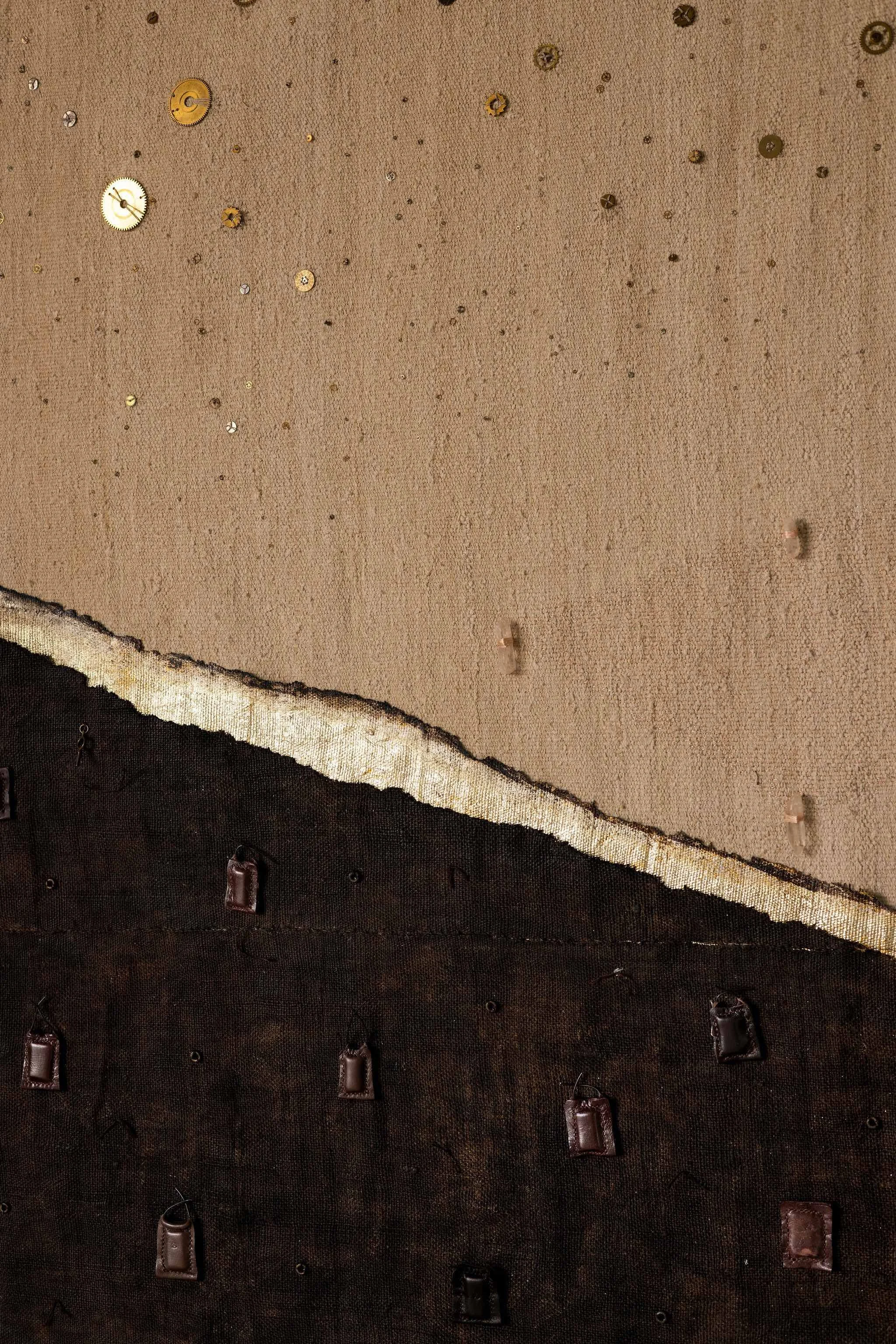 Detail of the charred and gold-leafed surface.