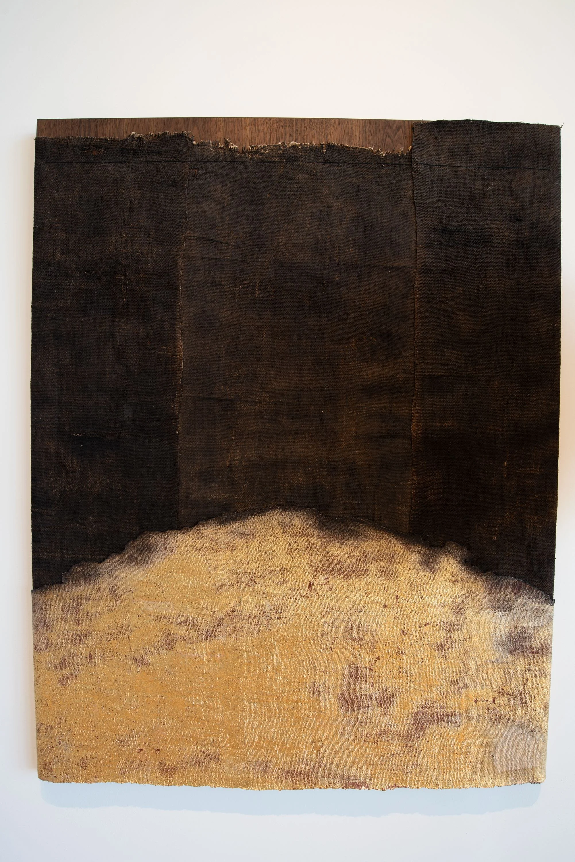 Rising Setting — charred linen with a gold-leaf field, mounted on walnut.